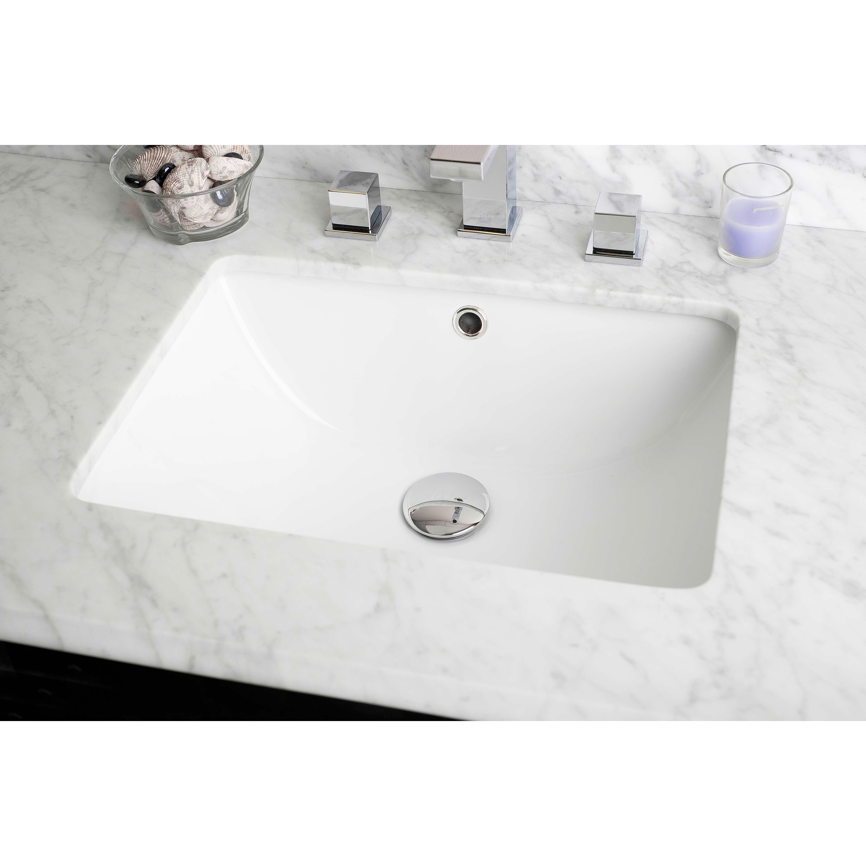 https://ak1.ostkcdn.com/images/products/is/images/direct/3497b9d202aa74953a3e3bd57b2d30710adc8fe7/18.25-in.-W-Rectangle-Undermount-Sink-Set-In-White---White-Hardware.jpg
