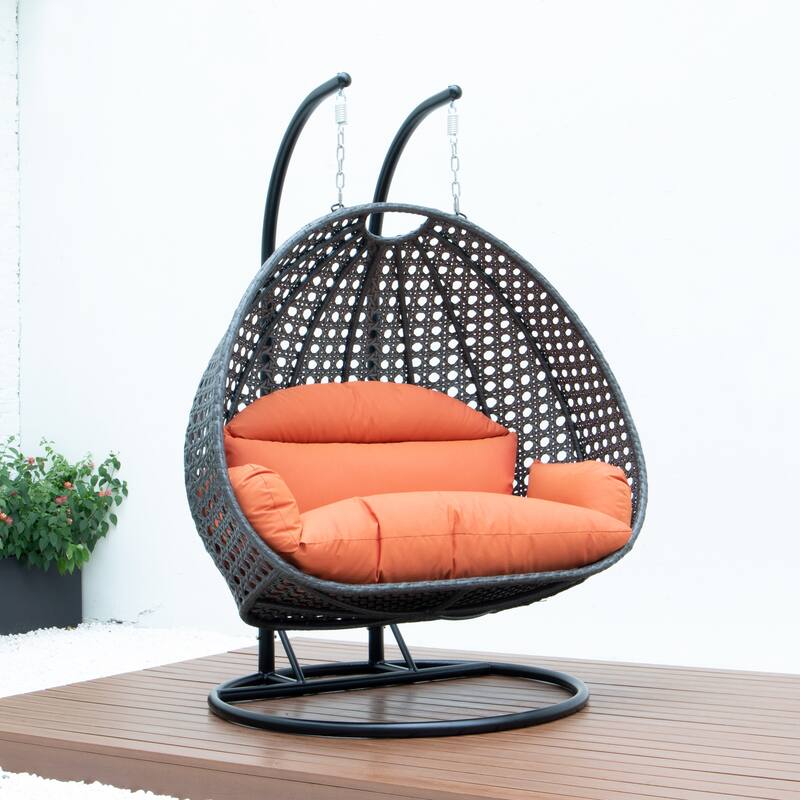 LeisureMod 2-Person Hanging Egg Swing Chair with Metal Stand - Handcrafted Charcoal Wicker, Patio Hammock Lounger with Cushions