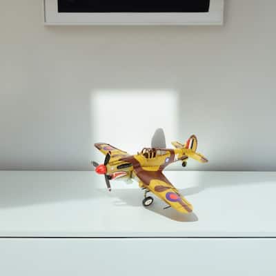 HomeRoots 6" Yellow and Brown Metal Hand Painted 1941's P-40 Fighter Model Airplane - 20' X '6' X '17