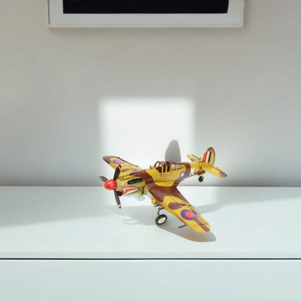 HomeRoots 6" Yellow and Brown Metal Hand Painted 1941's P-40 Fighter Model Airplane - 20' X '6' X '17