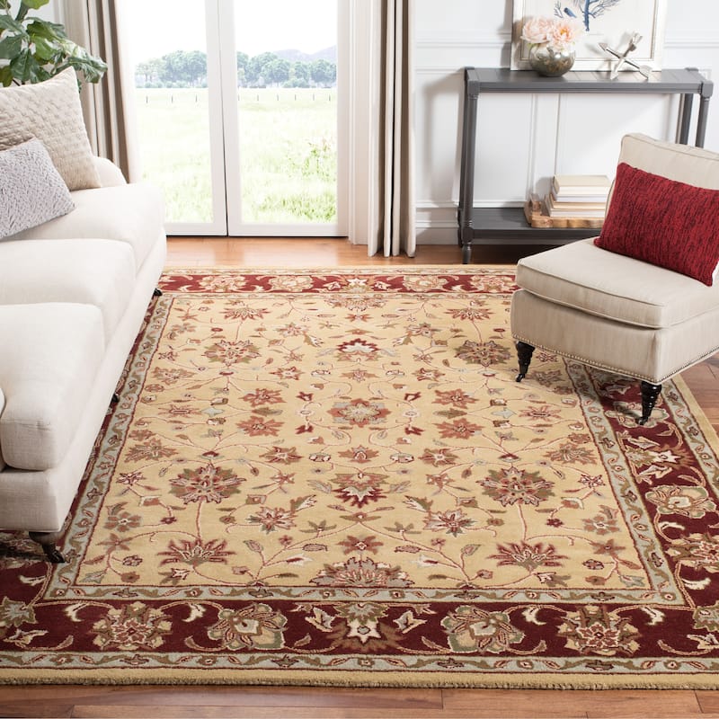 SAFAVIEH Handmade Heritage Rosamond Traditional Oriental Wool Rug - 6' x 9' - Ivory/Red