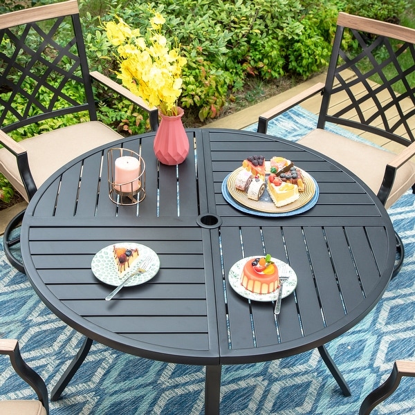 round wrought iron table and 4 chairs