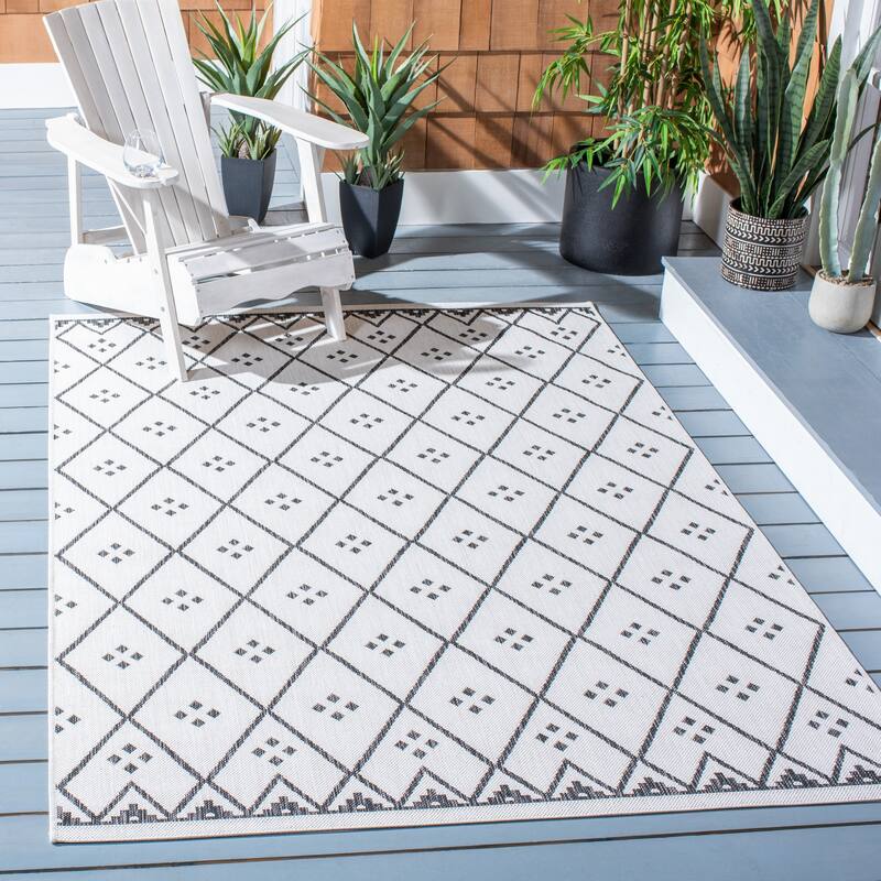 SAFAVIEH Courtyard Mauriceta Indoor/ Outdoor Waterproof Patio Backyard Rug - 5'3" x 7'7" - Ivory/Black