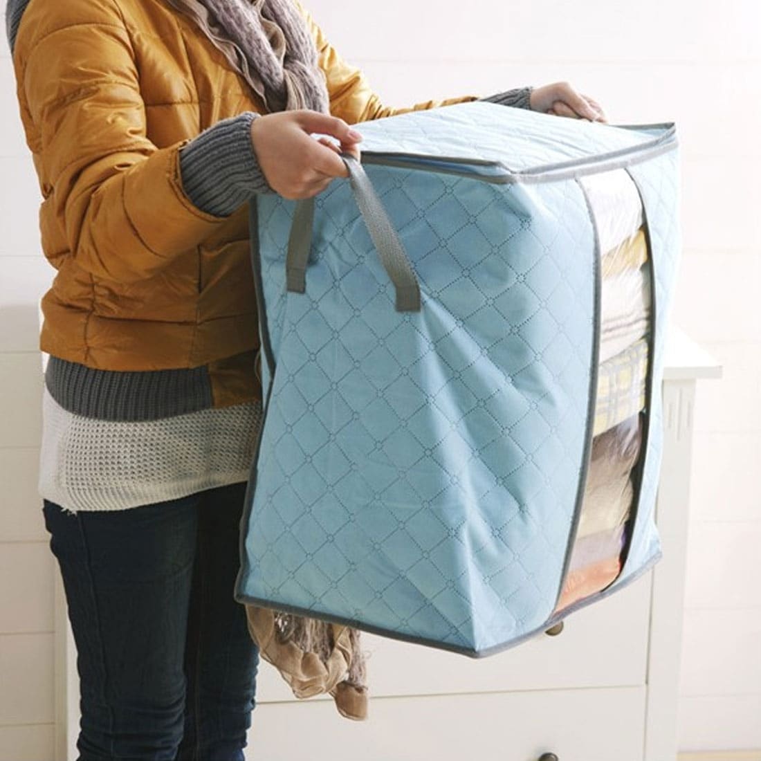 https://ak1.ostkcdn.com/images/products/is/images/direct/35b5725338fb7cad3d01578e0a575c26c2771b27/Blanket-Pillows-Quilts-Clothes-Storage-Bag-Organizer-Container-Blue-44x28x48cm.jpg