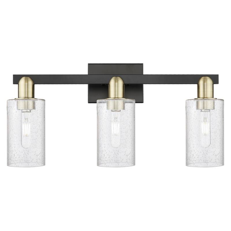 Innovations Lighting Endless Possibilities Arcadia - Clymer - 3 Light 23" Bath Vanity Light - Black Antique Brass/Seedy