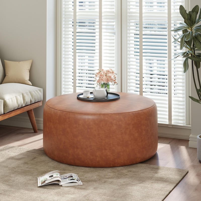 Upholstered round footstool