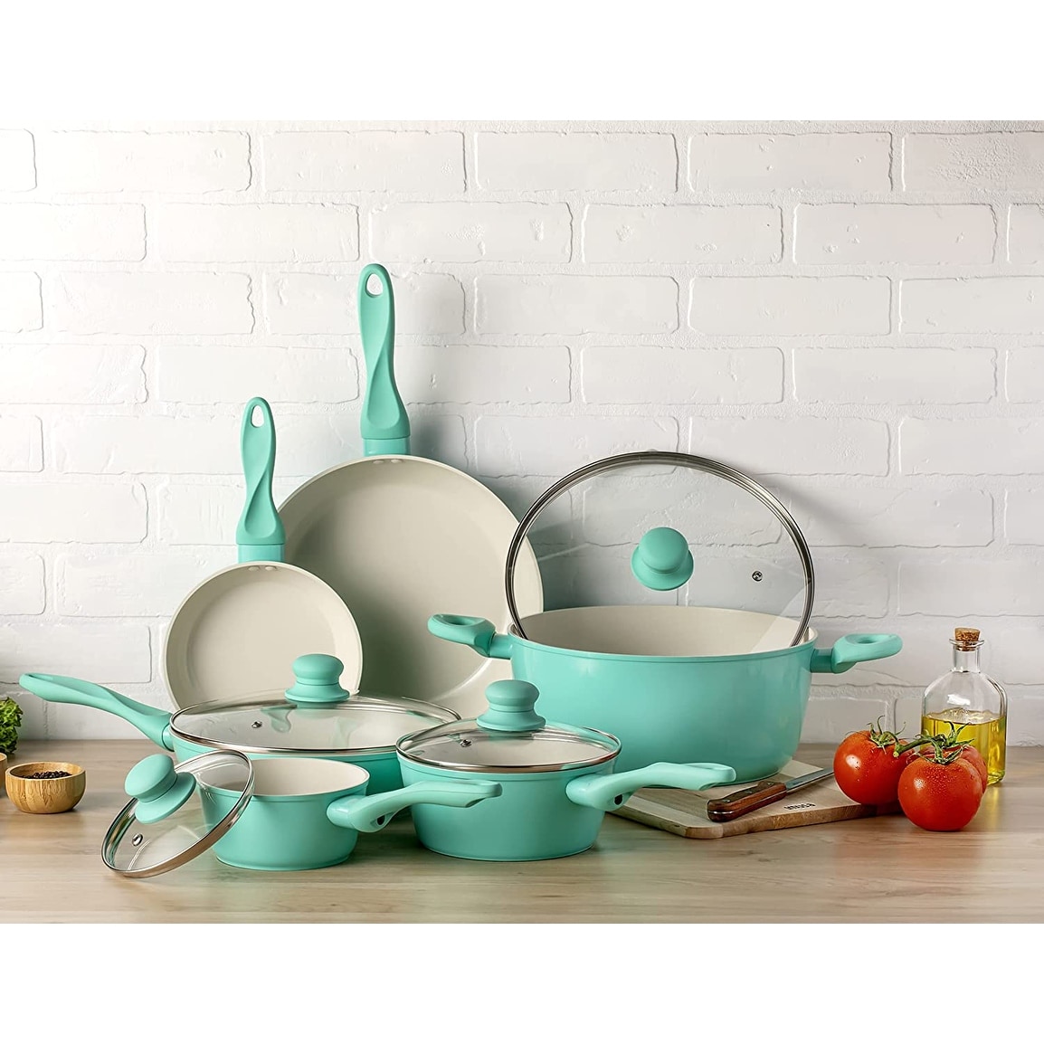 https://ak1.ostkcdn.com/images/products/is/images/direct/3657a0c42100e5e1dcee7ef7c03cd5fd8103ac85/USA-10pc-Forged-Nonstick-white-Interior-Ceramic-Teal-Cookware-Set.jpg