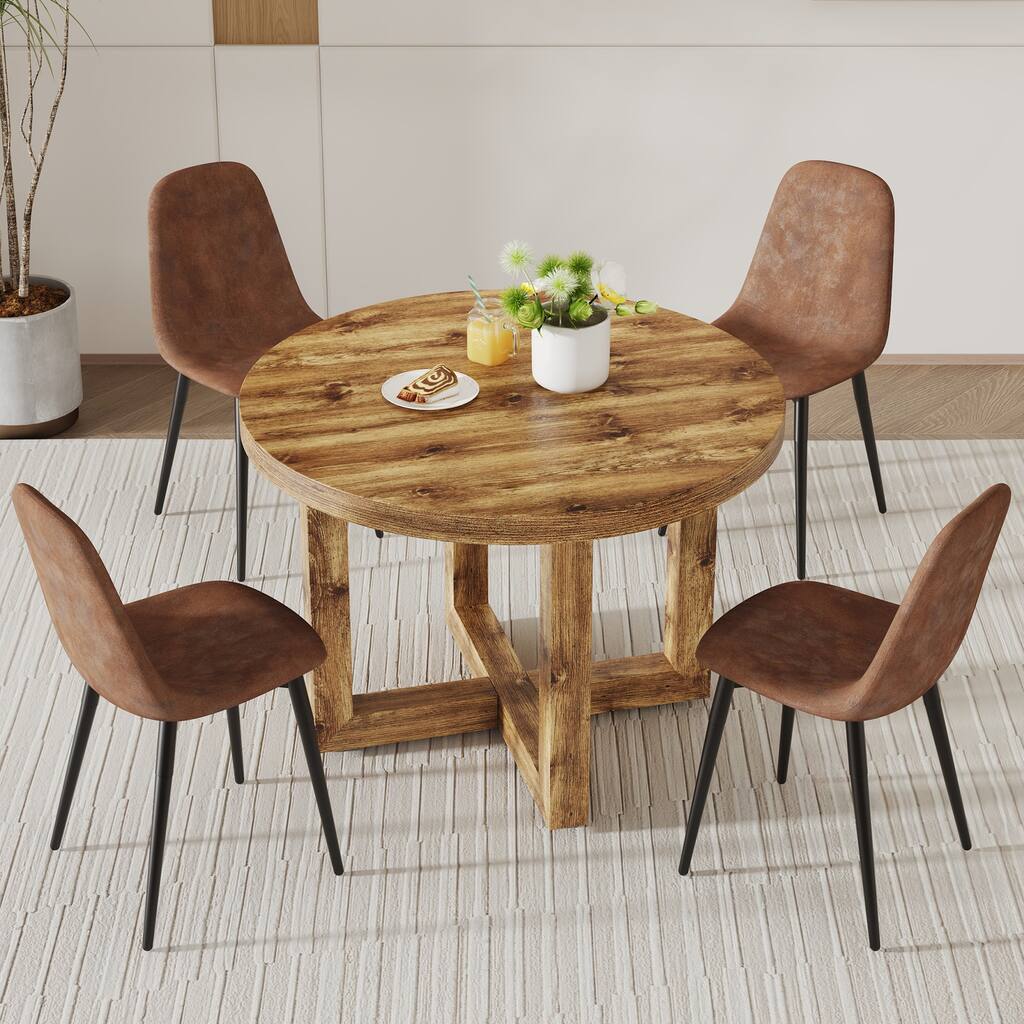A modern dining table. Made of MDF tabletop and wooden MDF table legs. A set of 4 brown cushioned chairs.