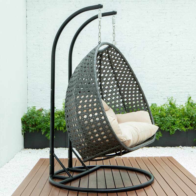 LeisureMod 2-Person Hanging Egg Swing Chair with Metal Stand - Handcrafted Charcoal Wicker, Patio Hammock Lounger with Cushions