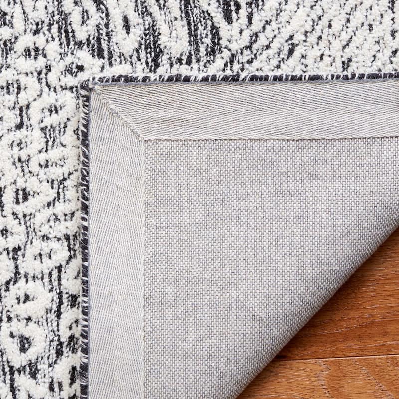 SAFAVIEH Handmade Ebony Siggi Modern Wool Rug