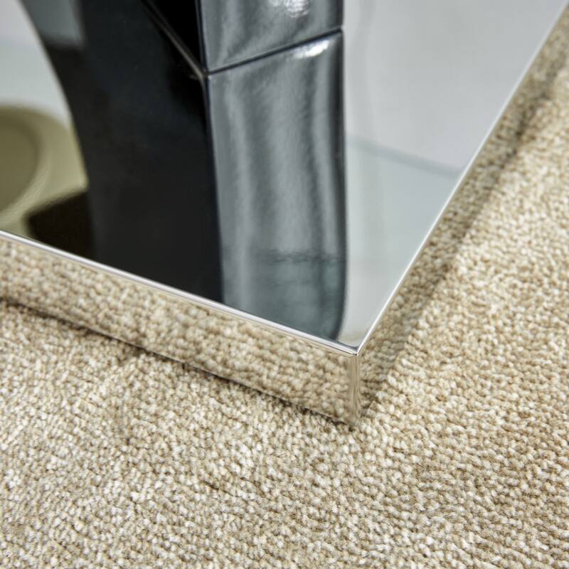 A rectangular modern and fashionable coffee table with tempered glass tabletop and black MDF legs