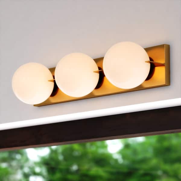 slide 2 of 13, Parkview 3-Light 24 in. W Bathroom Vanity Lighting Fixture Frosted Opal Glass Globe Shade Dimmable LED Compatible Full Backplate 24-in W x 5.5-in H x 6.25-in D - Satin Brass