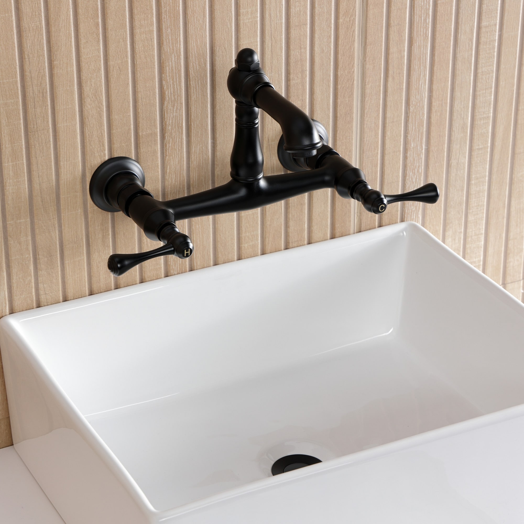 Kingston Brass English Country Two-Handle 2-Hole Wall Mount Bathroom Faucet