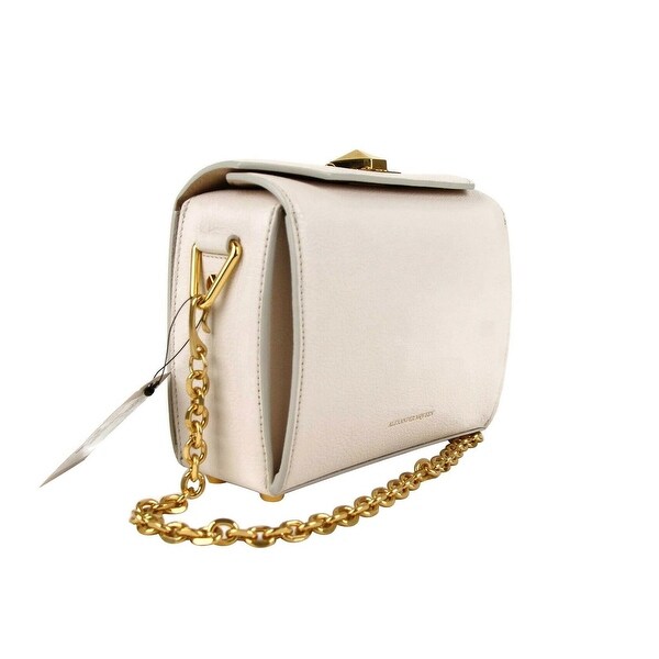 white purse with gold chain
