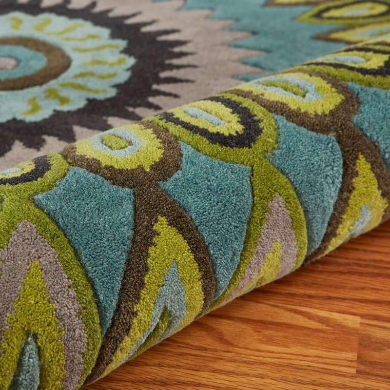 Sevita Bursting Peacock Wool Area Rug