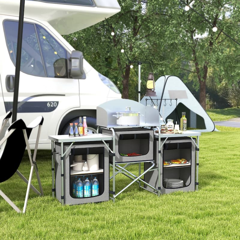 Outsunny Camping Kitchen Table, Portable Folding Camp Kitchen, Aluminum Cook Station with 3 Fabric Cupboards, Windshield - Grey