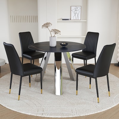 A 42-inch round black dining table with a granite top and stainless steel legs, paired with four PU material dining chai