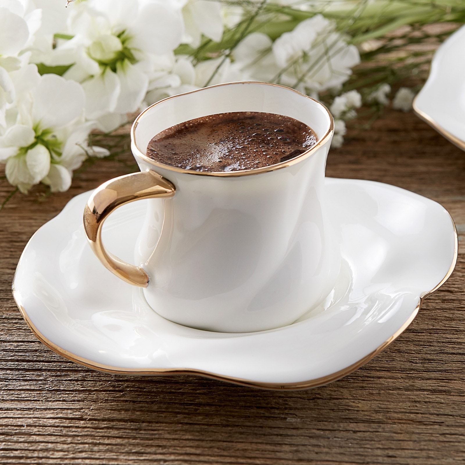 https://ak1.ostkcdn.com/images/products/is/images/direct/3a2a40102108dc1a4791dd69eb849346d9f74a76/Karaca-Flower-Gold-Rim-Bone-China-Coffee-Cup-Set-for-2.jpg