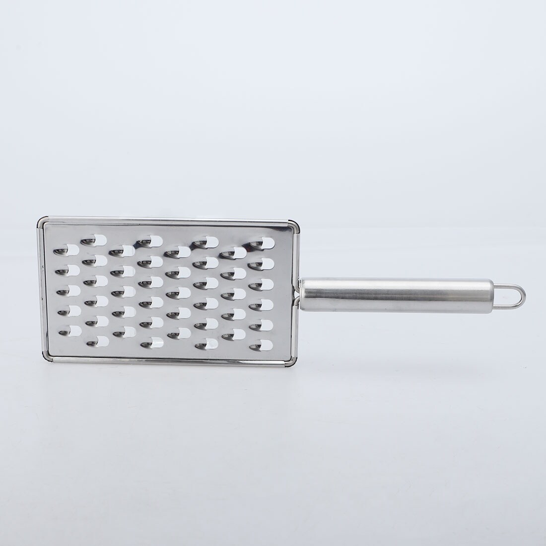 https://ak1.ostkcdn.com/images/products/is/images/direct/3a52fe510dcf85e51815027aba5c77588730be0b/Stainless-Steel-Cheese-Grater-Fruit-Vegetable-Grater-for-Kitchen-Restaurant.jpg