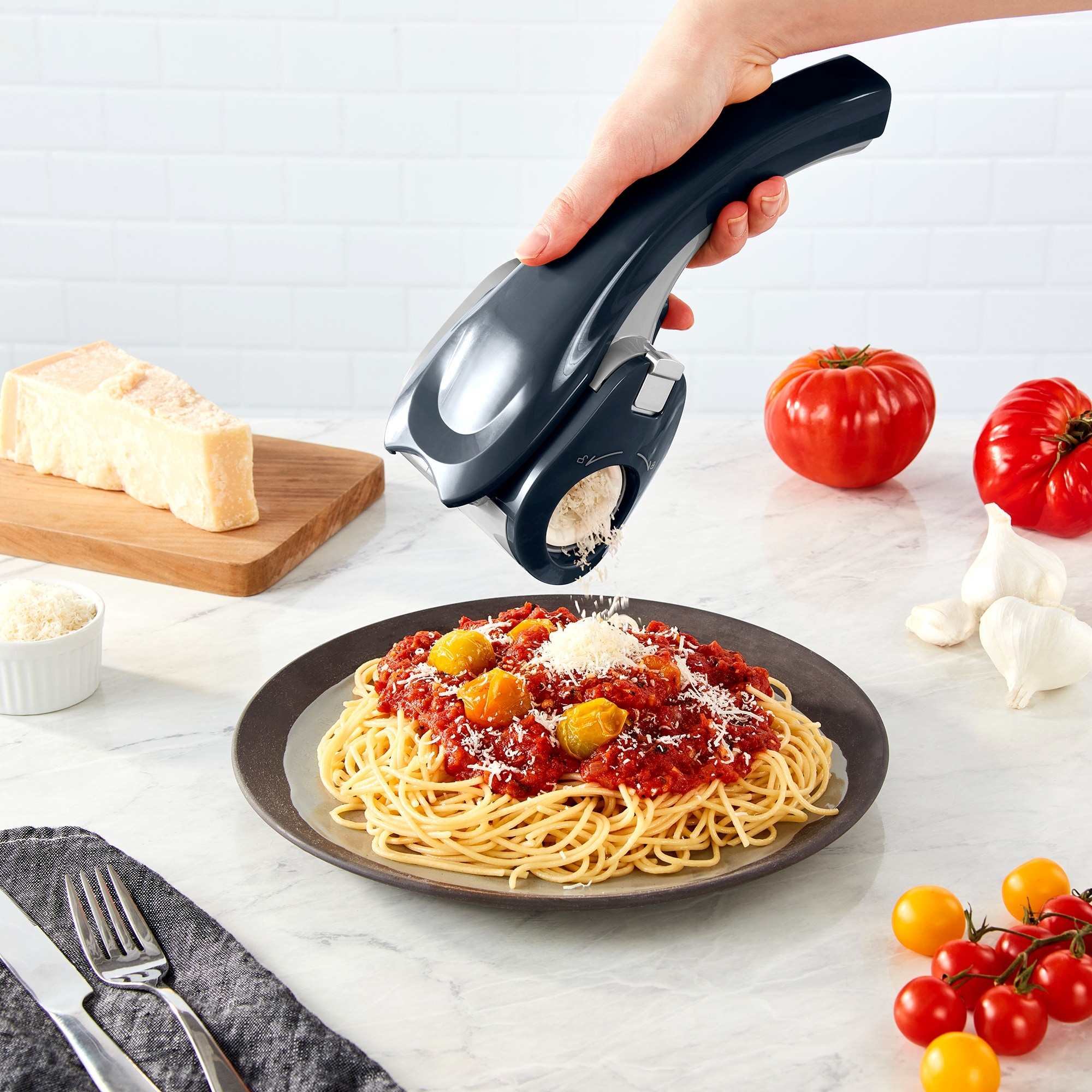 https://ak1.ostkcdn.com/images/products/is/images/direct/3a57b9567f5a9d2fbf4f0e69caf076a41708b600/Rechargeable-Electric-Rotary-Grater.jpg