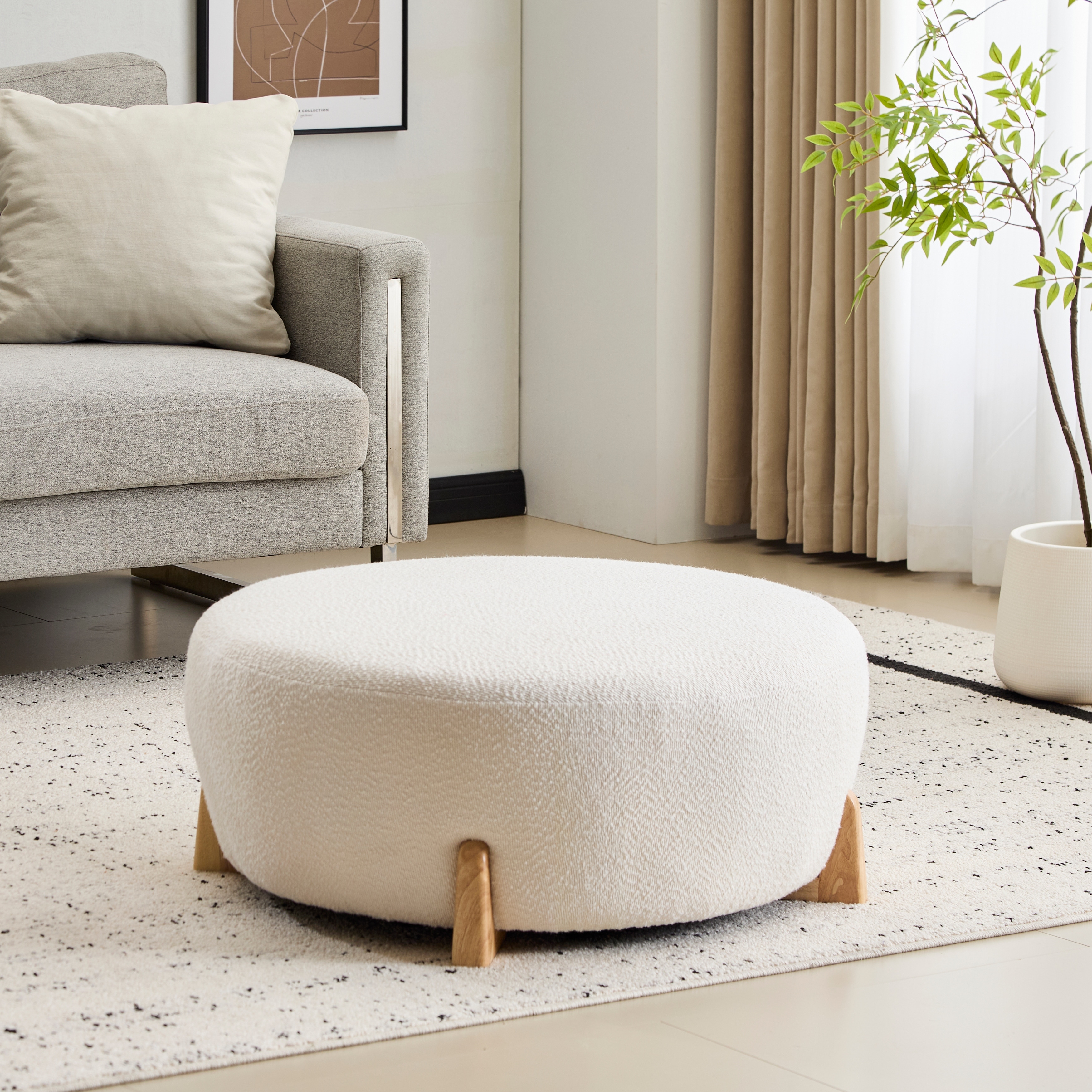 Modish White Round Boucle Ottoman with Splayed Rubber Wood Legs