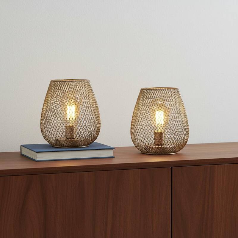 HomeRoots Set of Two 7" Silver And Gold Pierced Geometric Cordless Lantern Lamps - 5.60 in. x 6.70 in. x 5.60 in. - Silver - 5.60 in. x 6.70 in.  x 5.60 in.