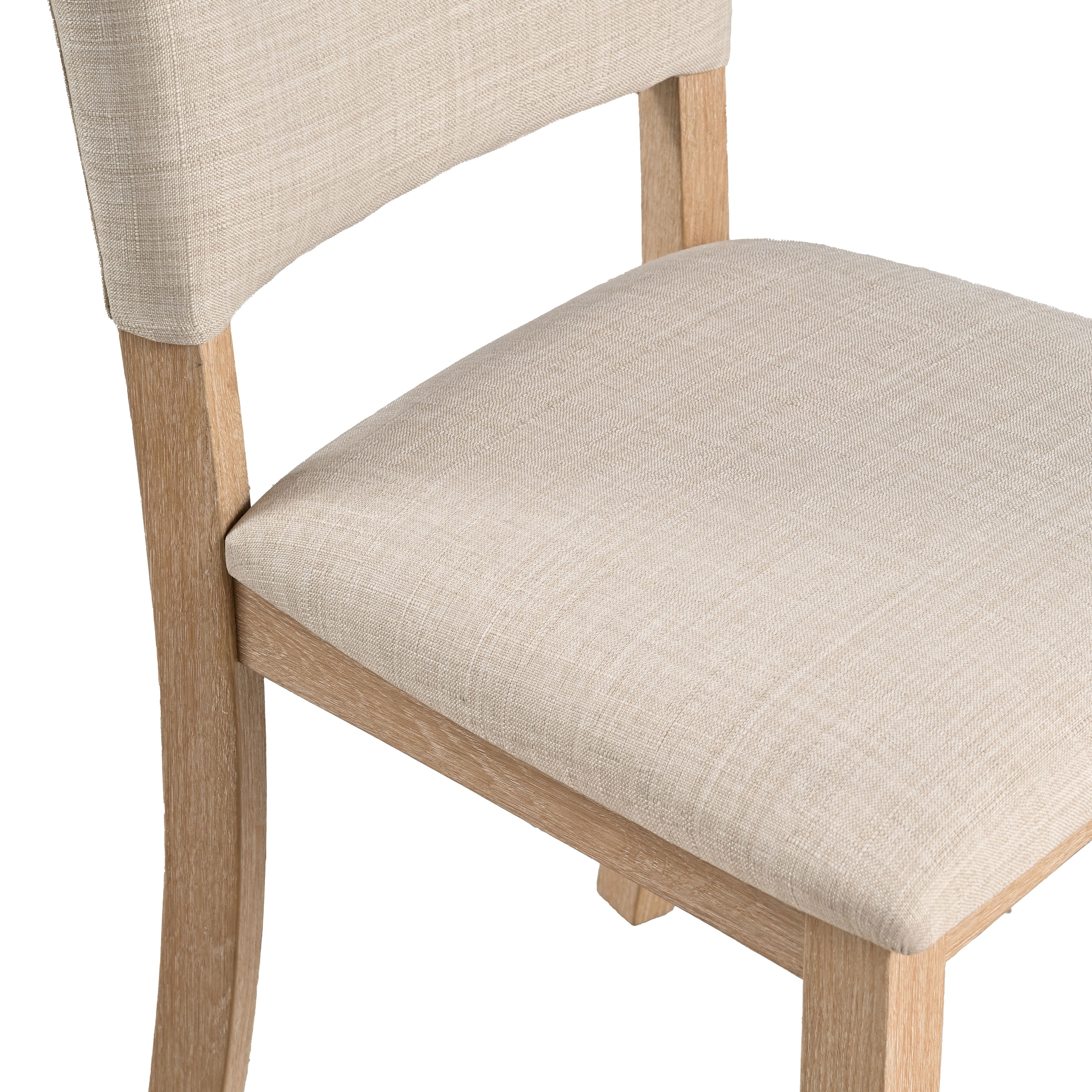 Close-up of the beige upholstered seat and wooden frame of a dining chair.