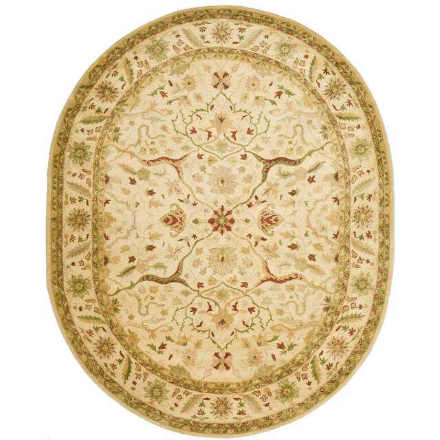 SAFAVIEH Handmade Antiquity Izora Traditional Oriental Wool Rug - 7'6" x 9'6" Oval - Ivory