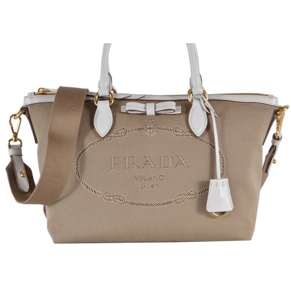 white and tan purse