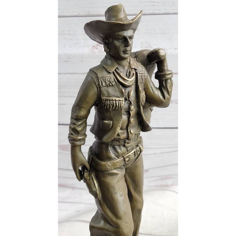 Country Western Cowboy In Chaps Carrying Imitative Horse Saddle Bronze Statue Sculpture Figure 12 Inches X 4 Inches