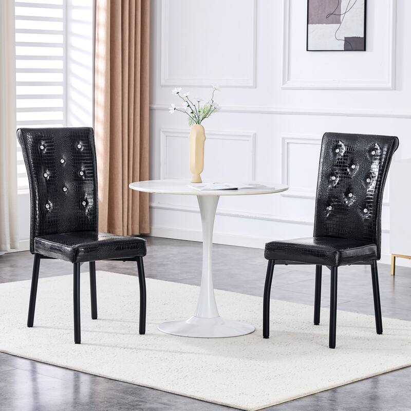 A set of 4 white and black vintage crocodile leather cushioned dining chairs, featuring crystal clasp design and leather