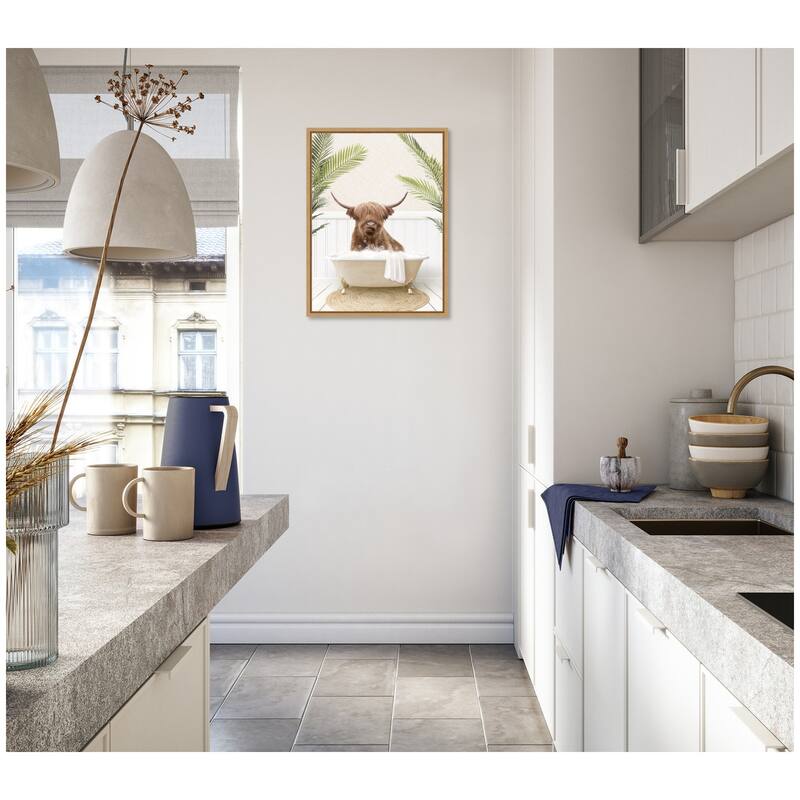 Kate and Laurel Sylvie Highland Cow in Palm Bathtub Framed Canvas by Amy Peterson