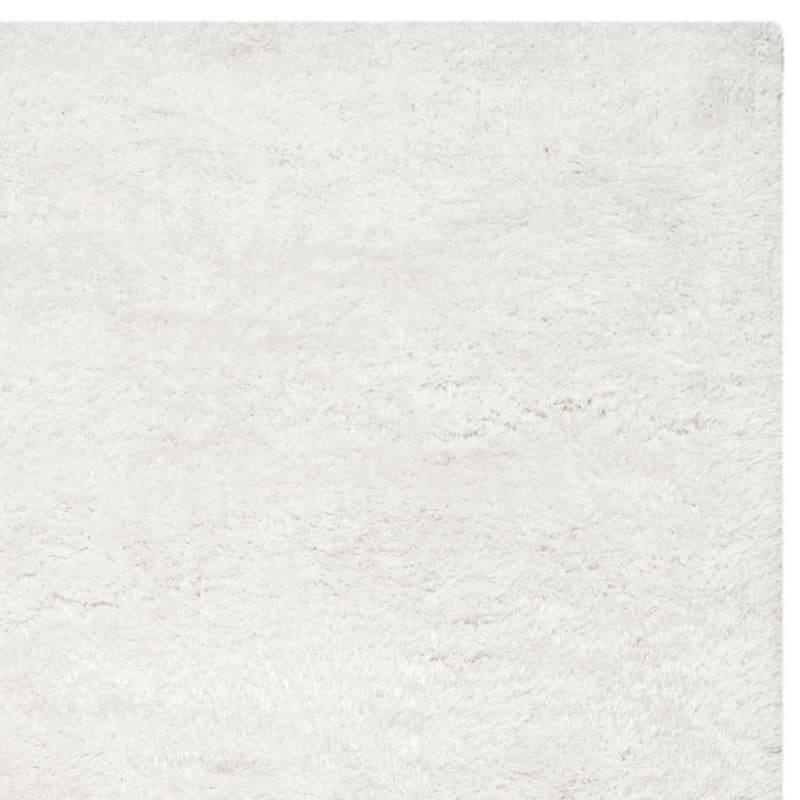 SAFAVIEH Handmade South Beach Leonella Shag Solid Polyester Rug