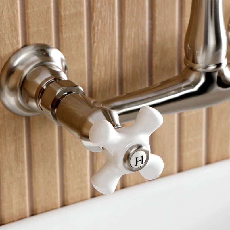 Kingston Brass English Country Two-Handle 2-Hole Wall Mount Bathroom Faucet