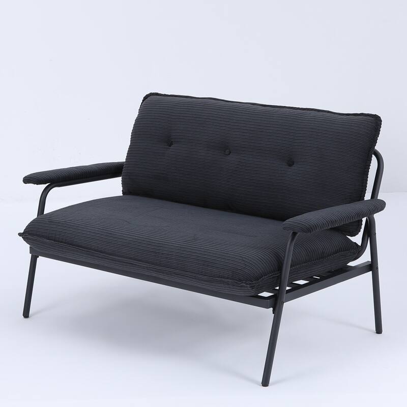 The 53-inch black sofa offers a spacious layout in the small apartment