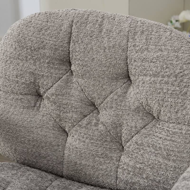 Grey Swivel Chair with Flip-Up Armrests and Crossed Legs