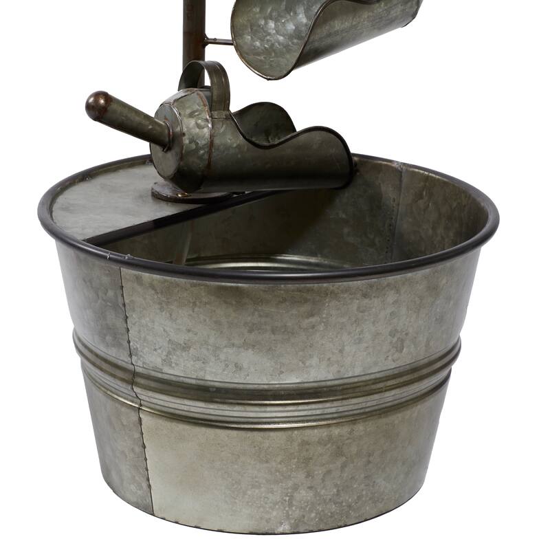 Gray Metal Fountain with Watering Cans