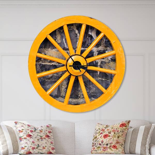 slide 2 of 10, Designart 'Yellow wooden Wagon Wheel Country' Oversized Farmhouse Wall CLock