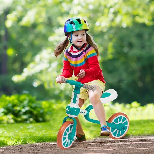 baby riding tricycle