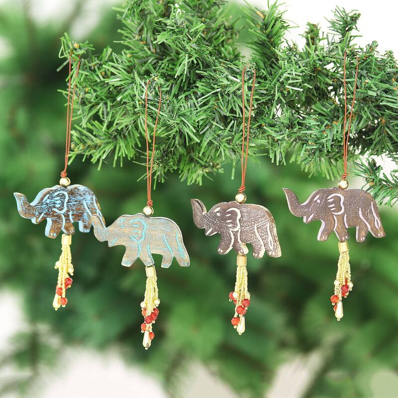 NOVICA Elephant Celebration, Wood ornaments (set of 4) - Each: 1.8" H x 3" W x 0.3" D