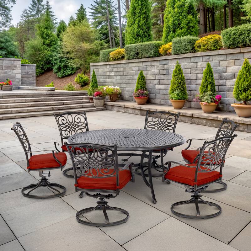 Hanover Traditions 7-Piece Dining Set in Red with a 60 In. Round Cast-top Table and Six Swivel Rockers