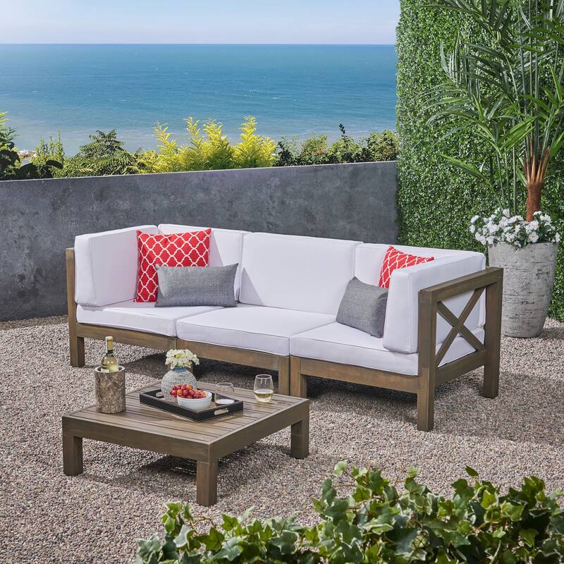 Brava Outdoor 3-Seater Acacia Wood Sectional Sofa Set with Coffee Table and Cushions by Christopher Knight Home