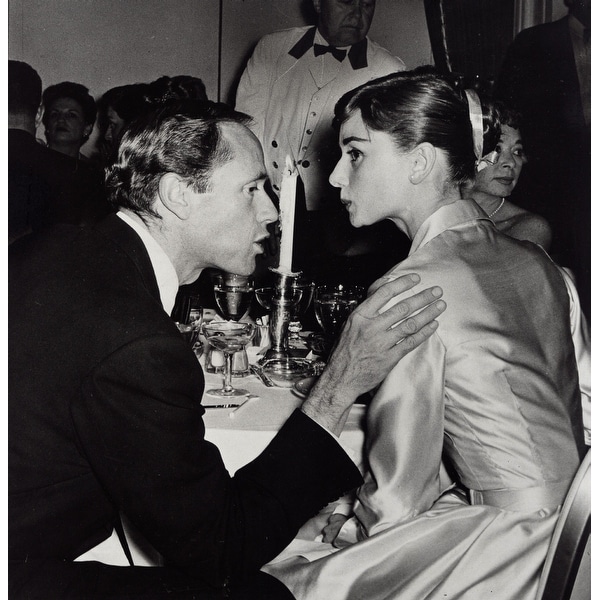 Audrey Hepburn and Mel Ferrer talking at an event Photo Print ...