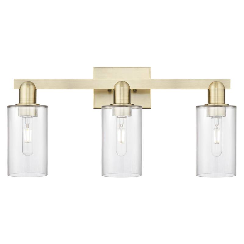 Innovations Lighting 716-3W-11-23 Clymer Vanity Clymer 3 Light 23" - Antique Brass / Clear