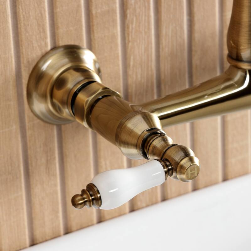 Kingston Brass English Country Two-Handle 2-Hole Wall Mount Bathroom Faucet
