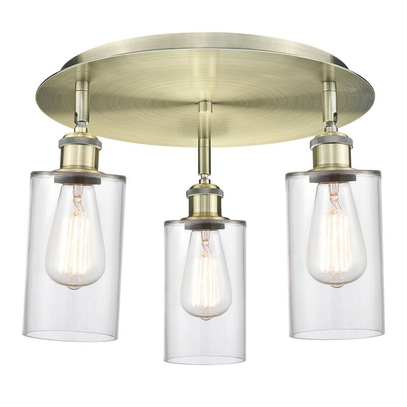 Innovations Lighting Clymer - 3 Light 16" Flush Mount - Antique Brass/Clear
