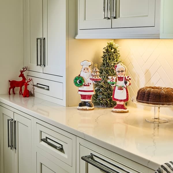 slide 2 of 3, 11-12" Resin Santa and Mrs Claus Sweets Set of 2