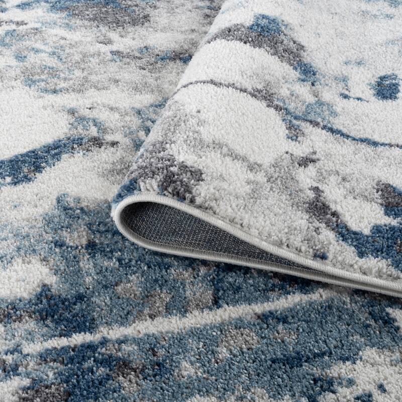 Avant Ivory and Blue Abstract Power-Loom Area Rug 2' x 3'
