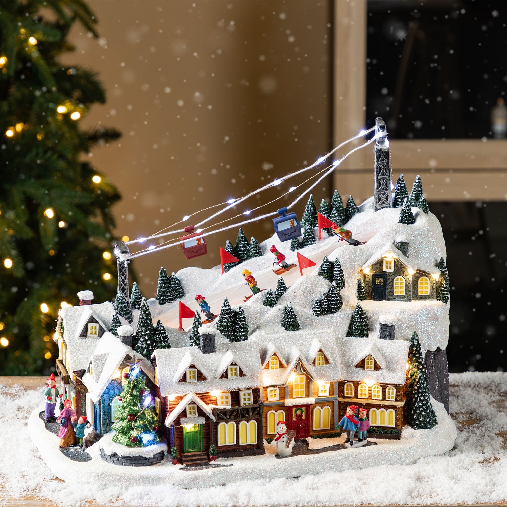 Glitzhome 16"H Christmas Oversized Resin Lighted Musical Skiing Table Village Decor with Timer