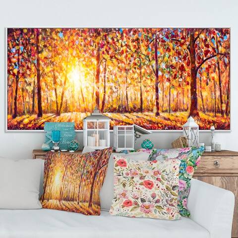 Designart "Sunlight Emerging Through The Autumn Forest Trees" Landscapes Framed Canvas Wall Art
